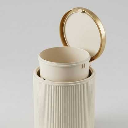 Oval trash can with the lid open and the removable inner bucket lifted out